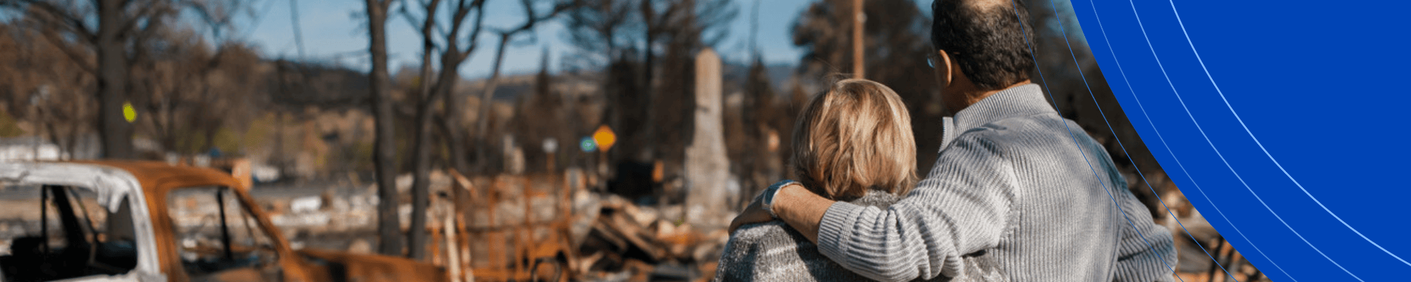 Man and woman observing the damage caused by wildfires