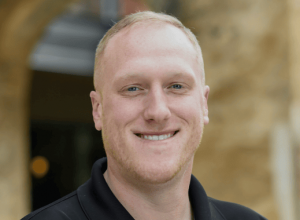 Man smiling wearing a black shirt