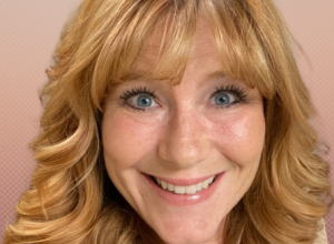 Woman with red hair smiling